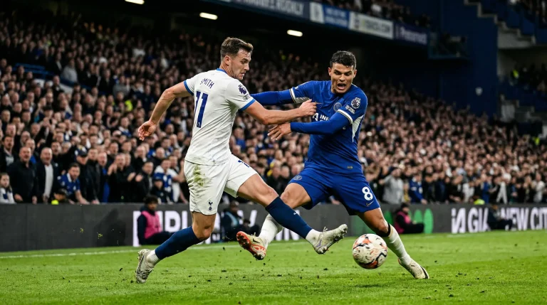 Soccer players competing for the ball during an international match under stadium lights